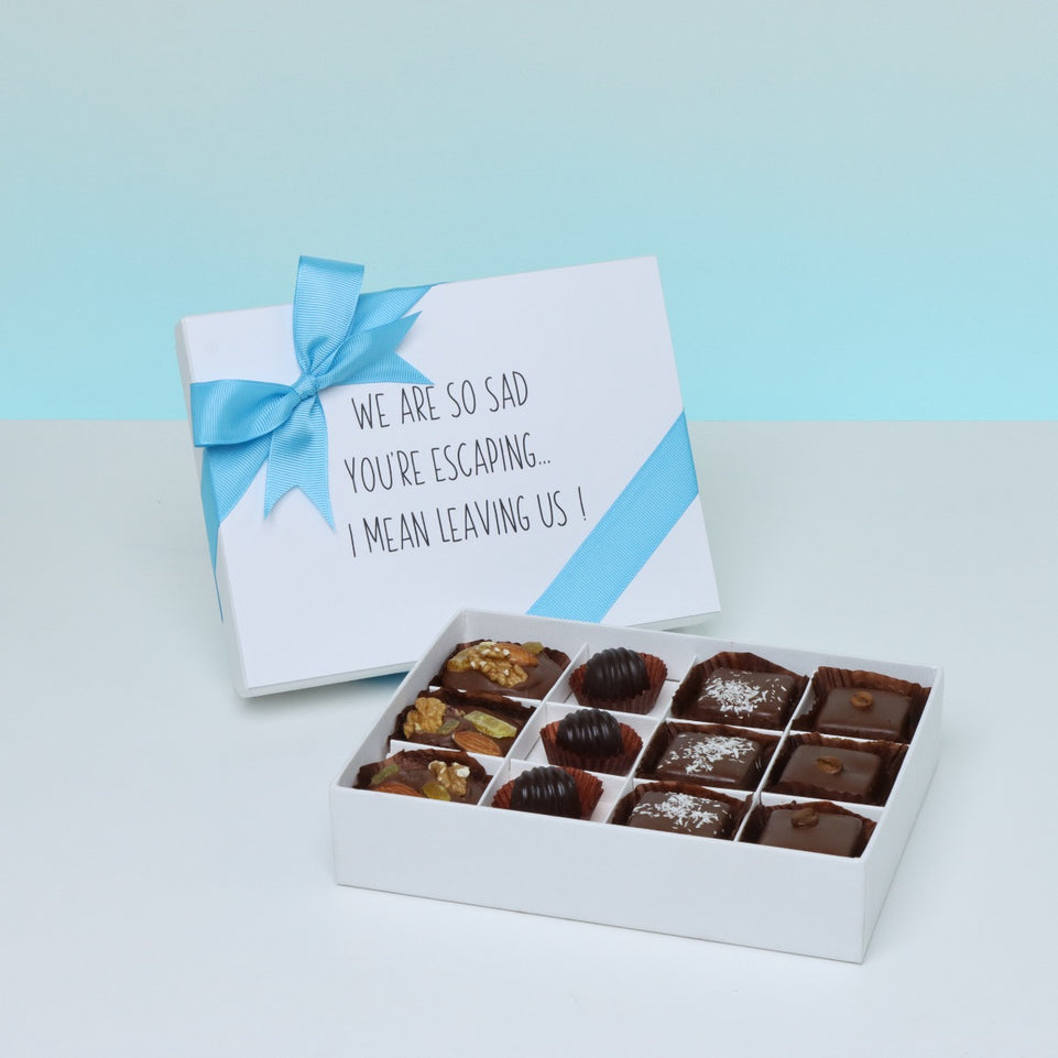 " WE'RE SO SAD YOU'RE ESCAPING" WORK MESSAGE 12- PIECE CHOCOLATE HARD BOX